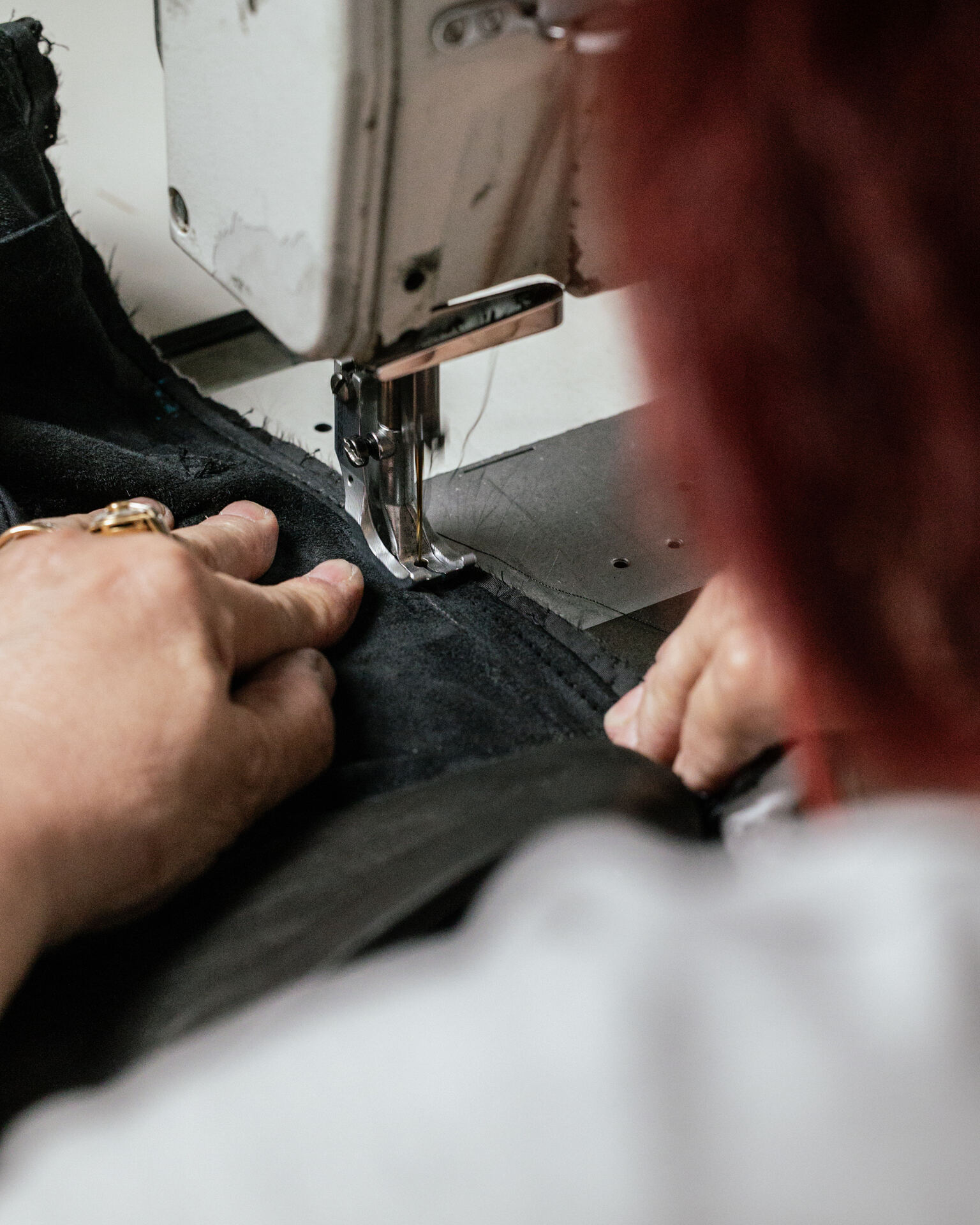 The fitting of a bespoke leather jacket in the atelier