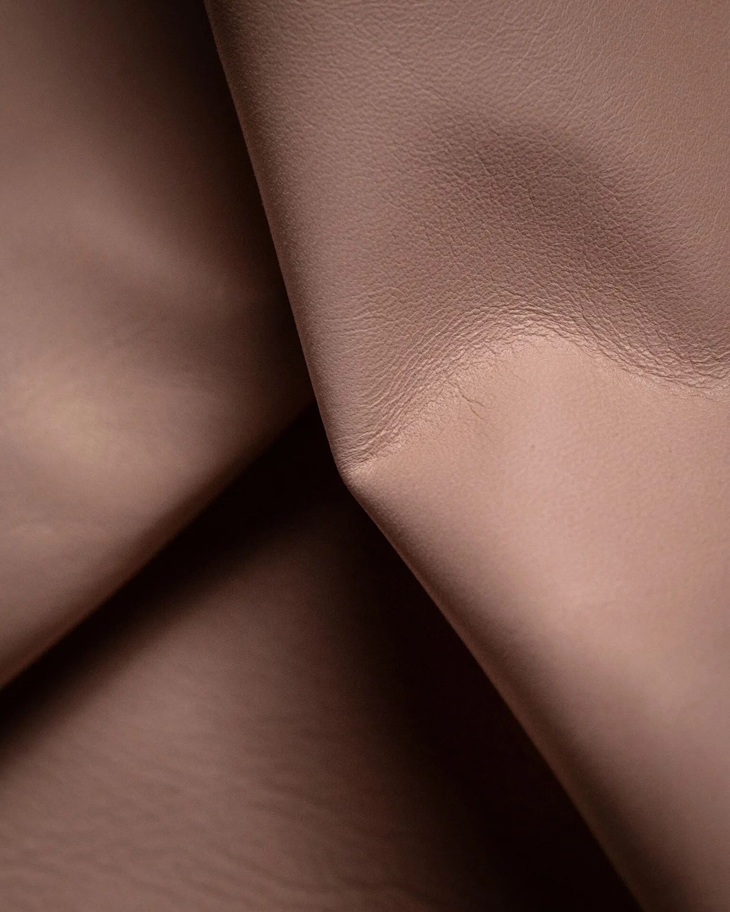 Macro of Tuscan vegetable tanned leather showing natural patina after ten years of wear, Riva Firenze atelier